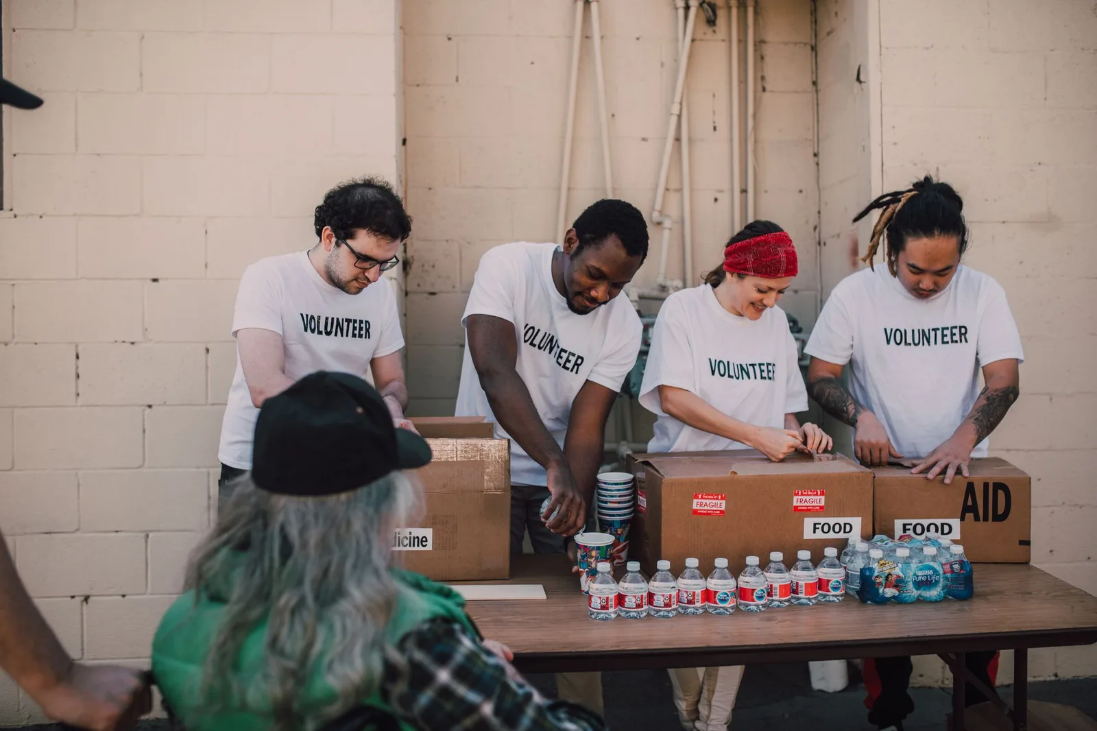 Two nonprofit team members reviewing a fundraising event budget at a table