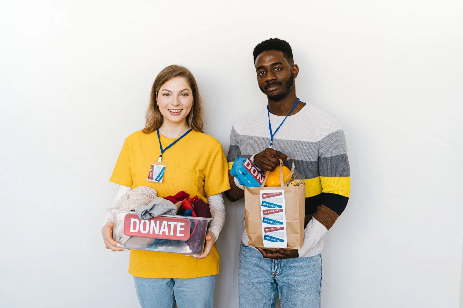 Two nonprofit staff members reviewing suggested donation amounts on a laptop in an office setting