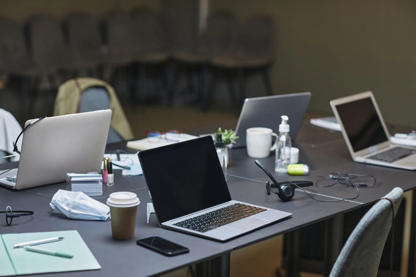 Two nonprofit staff members reviewing a donor spreadsheet on a laptop at a table