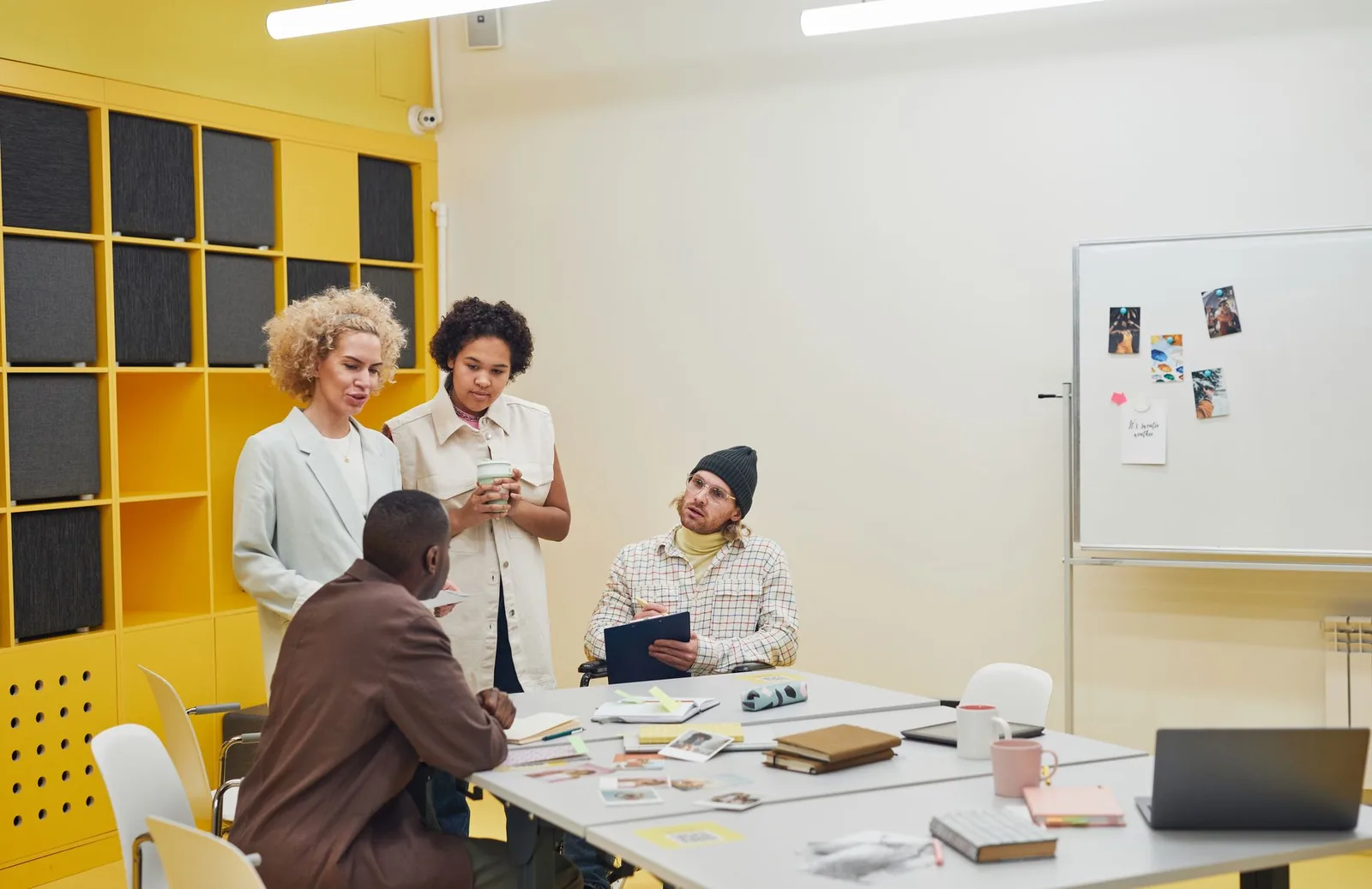 Small nonprofit team reviewing donor notes and fundraising reports at a table