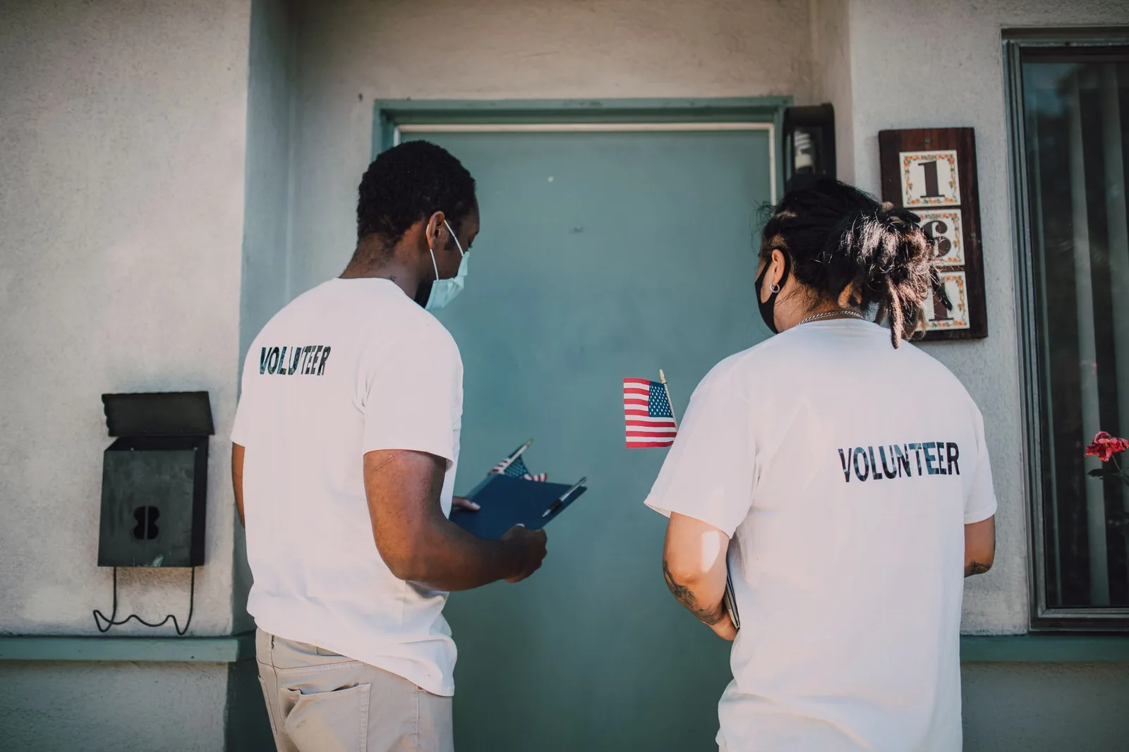 Nonprofit volunteers greeting guests at a gala registration table