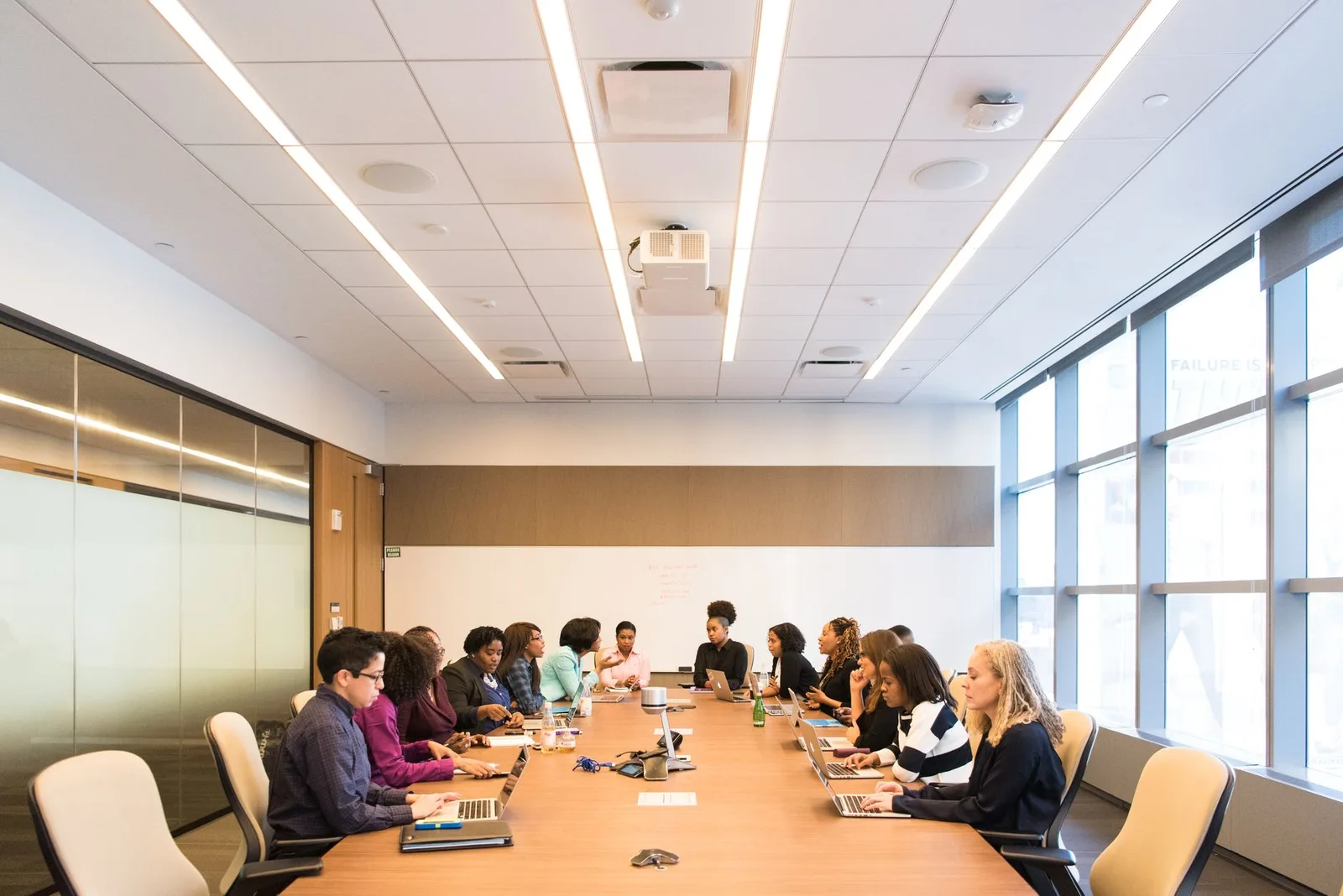 Small nonprofit board members reviewing documents at a meeting table